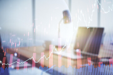 Multi exposure of abstract creative financial graph with world map on modern laptop background, forex and investment concept