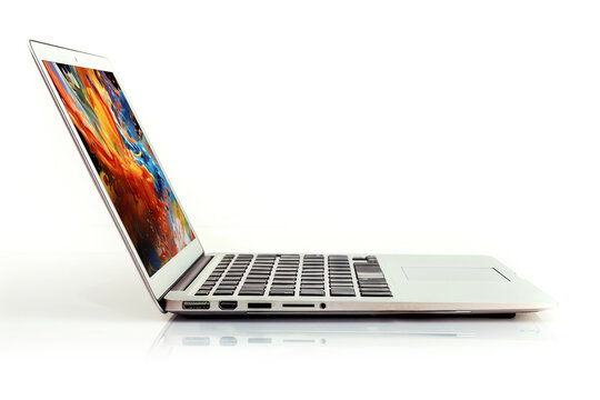 Modern laptop with colorful desktop picture on white background