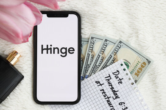 KYIV, UKRAINE - FEBRUARY 23, 2024 Hinge logo of famous dating website or app on iPhone display screen close up