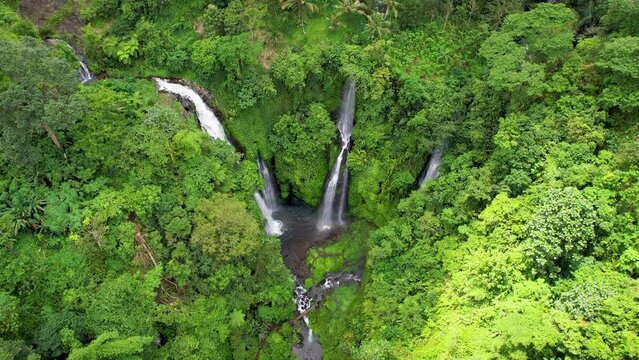 Orbital aerial footage of Fiji waterfall. Lemukih, Bali, Indonesia.