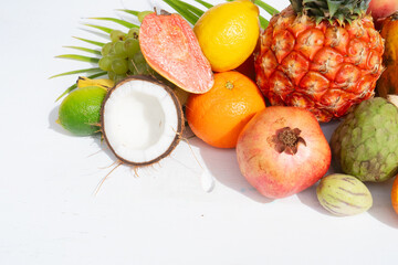 Summer mix of tropical fruits over white