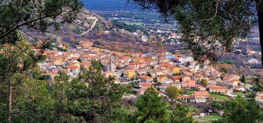 Zarzalejo town Sierra Madrid between pine forests aerial view old houses mountain