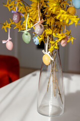 Easter tree in the interior. forsythia with easter eggs