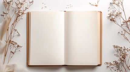 Mock-up of blank pages of an open notebook with copy-space for text on a white background with dry branches of autumn little flowers decoration.