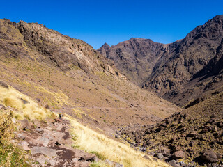 Tranquil hiking trail near Imlil. Valley route to Toubkal peak in Toubkal National Park, Atlas Mountains, Morocco