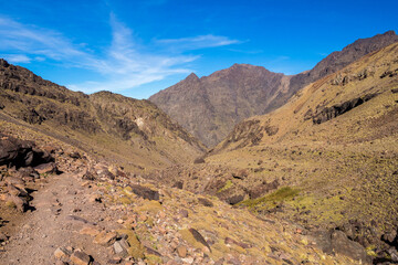 Fototapeta na wymiar Tranquil hiking trail near Imlil. Valley route to Toubkal peak in Toubkal National Park, Atlas Mountains, Morocco
