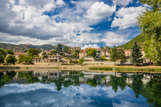 The beautiful village of Villalago, in the province of L'Aquila in Abruzzo, central Italy. The small lake near the town centre, immersed in the nature of the green Abruzzo mountains.