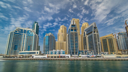 Fototapeta na wymiar Dubai Marina towers in Dubai at day time timelapse hyperlapse