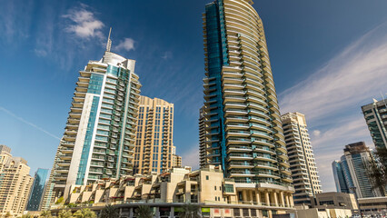 Fototapeta na wymiar Dubai Marina towers in Dubai at day time timelapse