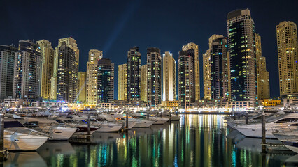 Dubai Marina towers and yachts in Dubai at night timelapse hyperlapse