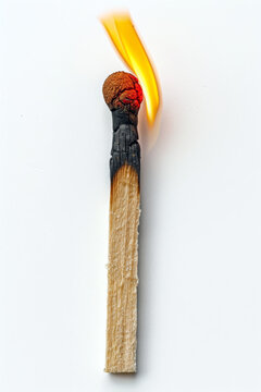 A matchstick catching fire close up image.