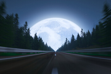 Enigmatic Full Moon Rising Over a Serene Forest Highway in the Heart of Night