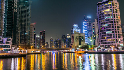 Dubai Marina towers and canal in Dubai night timelapse