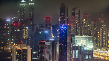 Aerial view of a big modern city at night timelapse. Business bay, Dubai, United Arab Emirates.