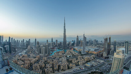 Fototapeta premium Dubai Downtown day to night timelapse view from the top in Dubai, United Arab Emirates