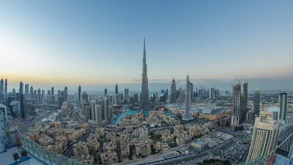 Wandcirkels aluminium Dubai Downtown day to night timelapse view from the top in Dubai, United Arab Emirates © neiezhmakov
