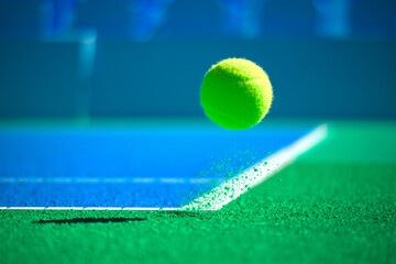 Intense Moment: Close-Up of a Tennis Ball Suspended in Midair During a Match