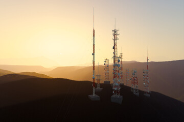 Majestic Sunset Over Remote Radio Antenna Towers Amidst Mountainous Landscape