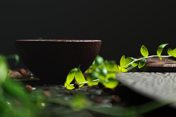Serene Spa Concept: Green Leaves, Wooden Bowl, and Tranquil Water Close-Up