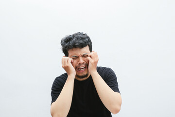 an asian man crying and screaming