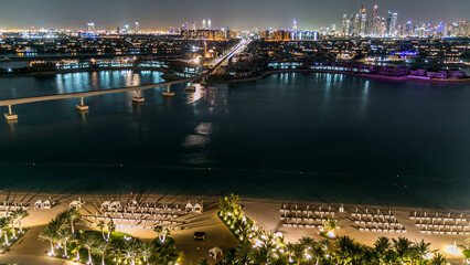 Jumeirah Palm island skyline night timelapse in Dubai, UAE.