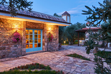 Modern stone house and decorative outside concept, night style.