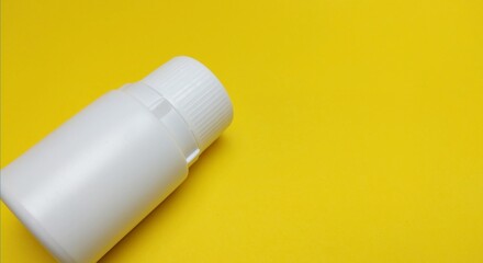 medicine bottle over yellow background