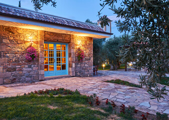 Modern stone house and decorative outside concept, night style.