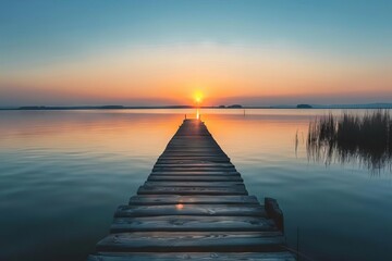 Rustic Wooden Pier Extending into Calm Lake at Sunset, Peaceful Landscape Photography - obrazy, fototapety, plakaty