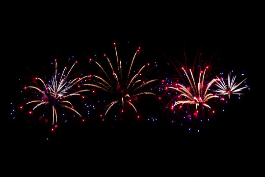 Beautiful abstract pattern with salute fireworks on dark background. Holiday card design.