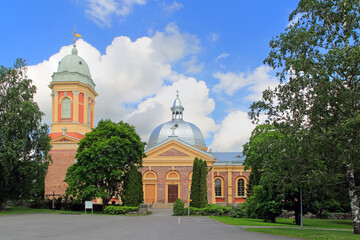 Fototapeta na wymiar The beautiful red-brick Kanta-Loimaa Church in Hirvikoski, Loimaa, Finland, completed in 1837, represents the renaissance revival style.
