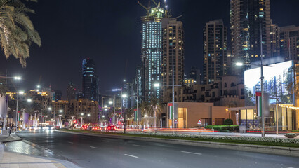 Fototapeta premium Street view of Dubai skyline timelapse and rush hour traffic in downtown at night