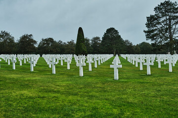 American War Cemetery memorial near Omaha Beach, the place where allied forces landed on the beach of the Normandy to fight back the Nazis in WWII. - obrazy, fototapety, plakaty