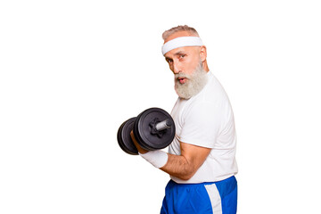 Cool playful flirty naughty strong grandpa with confident grimace exercising holding equipment up,...
