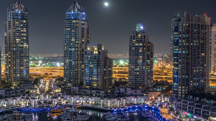 Fototapeta na wymiar Dubai Marina at night timelapse, Glittering lights and tallest skyscrapers