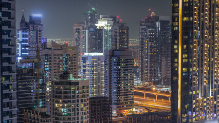 Fototapeta na wymiar Dubai Marina and JLT at night timelapse, Glittering lights and tallest skyscrapers