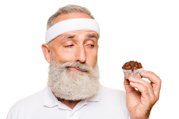 Athlete cool uncertain unsure ponder fit picky grandpa holds forbidden tasty yummy treat, decides. Weightloss, healthcare, restriction, question, thoughts, workout, gym, regime, bodycare - obrazy, fototapety, plakaty
