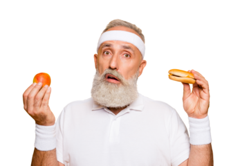 Athlete cool uncertain unsure ponder fit picky grandpa holds forbidden cheeseburger and fruit, decides. Weightloss, restriction, question, thoughts, workout, gym, regime, desire, wish, bodycare