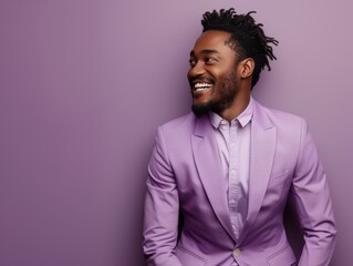 A man in a purple suit is smiling and looking at the camera