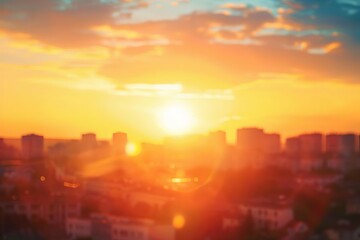 Warm golden hour sunset over city rooftops with blurred summer sky, abstract background - obrazy, fototapety, plakaty