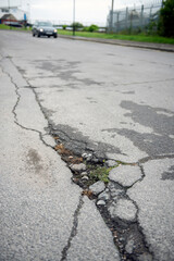 UK patchwork roads potholes, and recent repairs already falling apart.