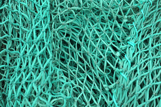 Abstract blue nylon fishing nets.