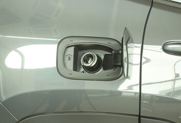 Open fuel tank door on car for fueling gasoline or diesel open. Transportation industry concept