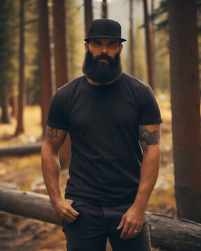 Male model posing outdoors with plain blank black canvas t-shirt mockup