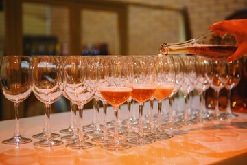 Elegant Evening of Pouring Rose Wine Into Crystal Glasses at Tasting Event - 767116524