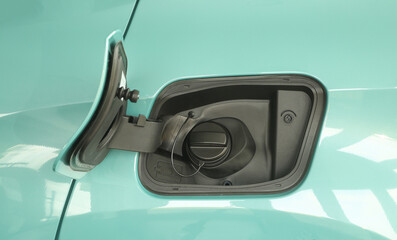 Open fuel tank door on car for fueling gasoline or diesel open. Transportation industry concept  