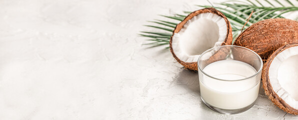 Coconut Milk in a glass with Coconut. Clean eating, dieting, vegan food concept. copy space