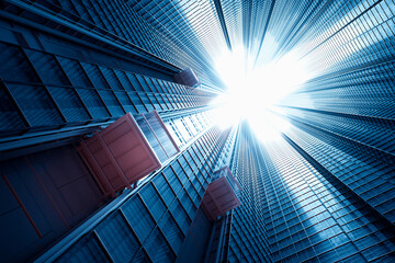 Majestic Urban Skyline: Glistening Glass Towers Under A Clear Blue Sky