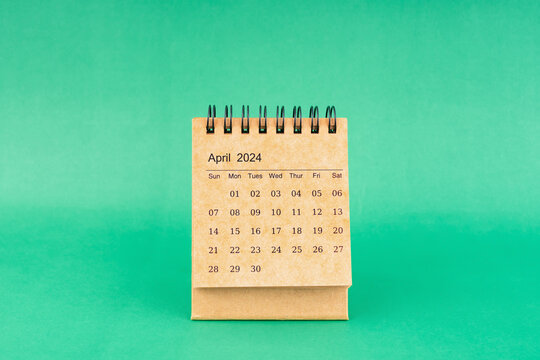April 2024 desk calendar isolated in green background.