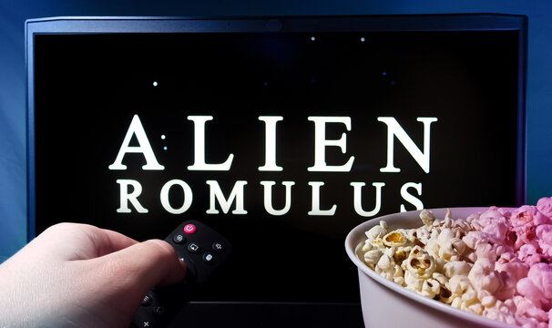 The viewer watches the film Alien romulus with the remote control in his hand. Stock editorial photo. Ukraine. Kiev. 04.14.2024
